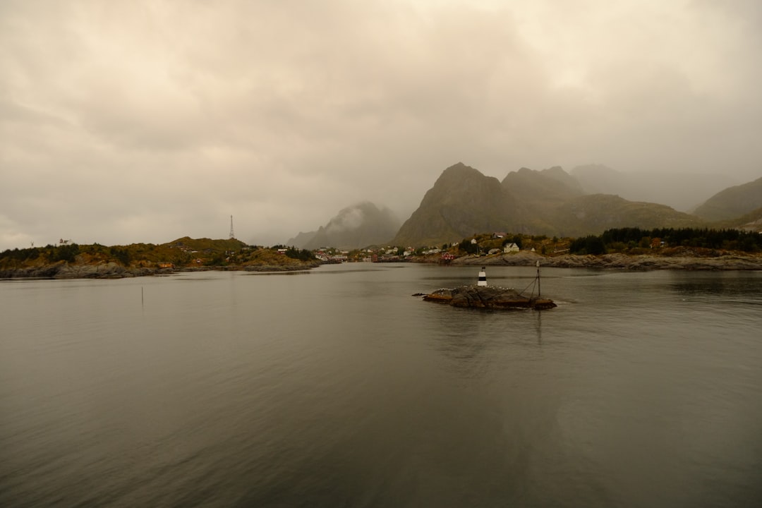 a-foggy-coastal-village-nestled-among-mountains-3irqbisxo20
